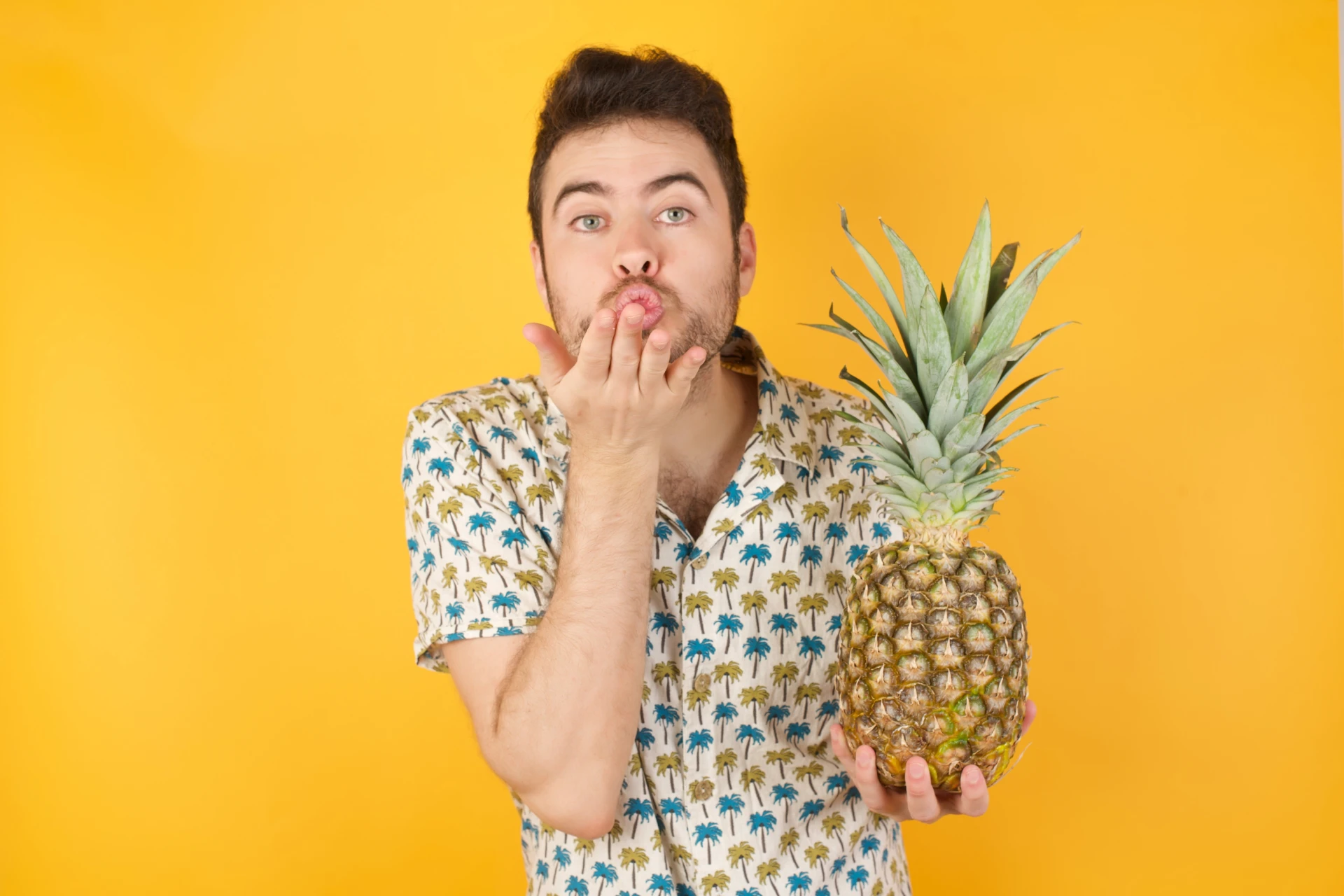 pineapple_lover Man holding pineapple and blowing kiss