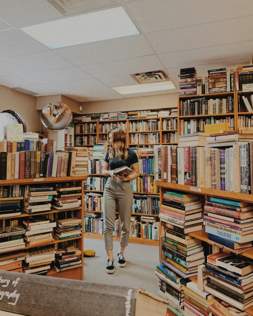 Woman standing in a second hand bookstore
