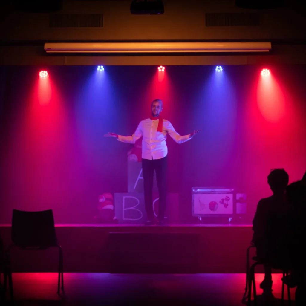 Man performing stand-up comedy on stage