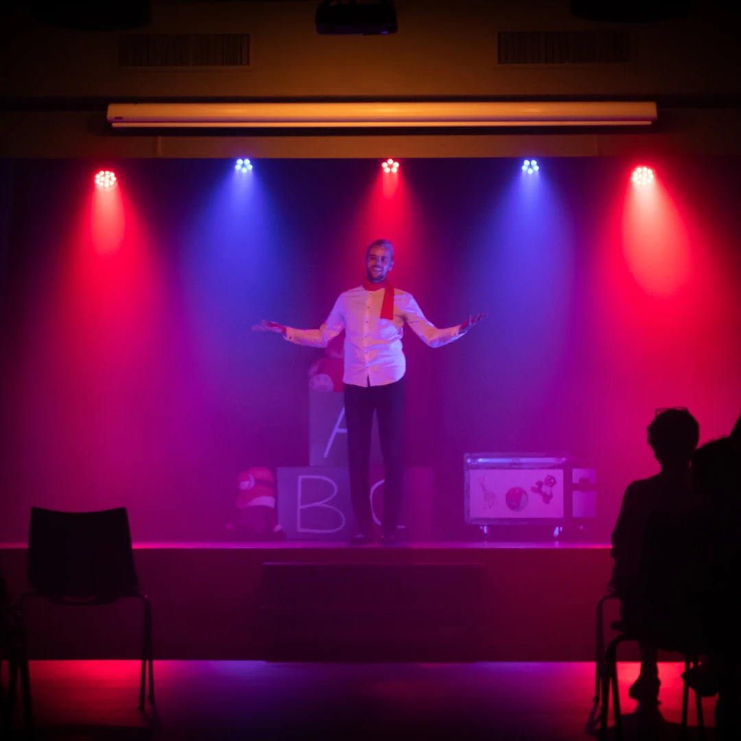 comedy-club Man performing stand-up comedy on stage