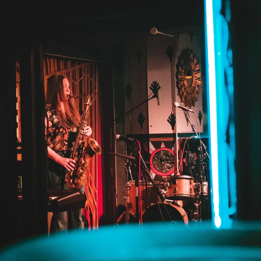 Saxophonist performing in a cool jazz club