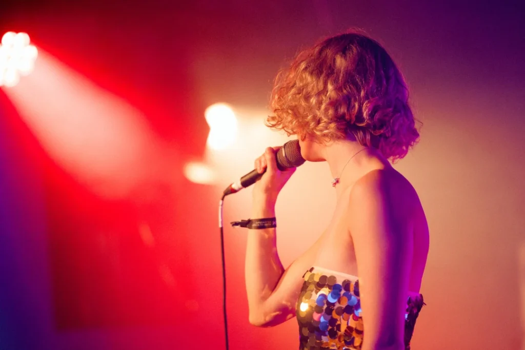 young woman singing karaoke
