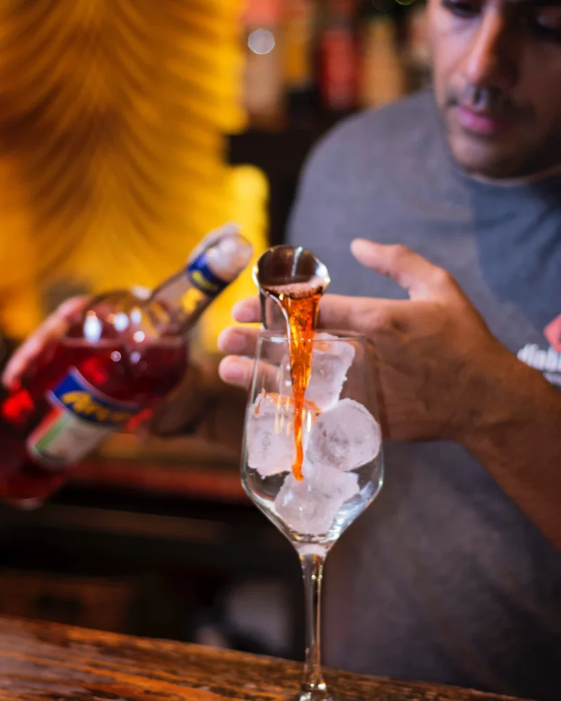 A man making a cocktail at a bar
