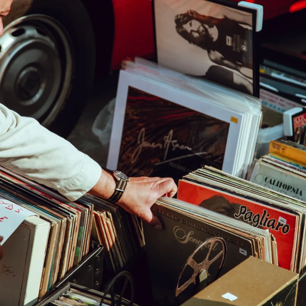 Man riffling through vinyls at a record store