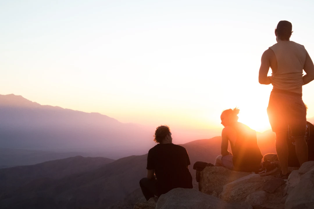 sunrise-hike Group of friends watching the sunrise during a hike